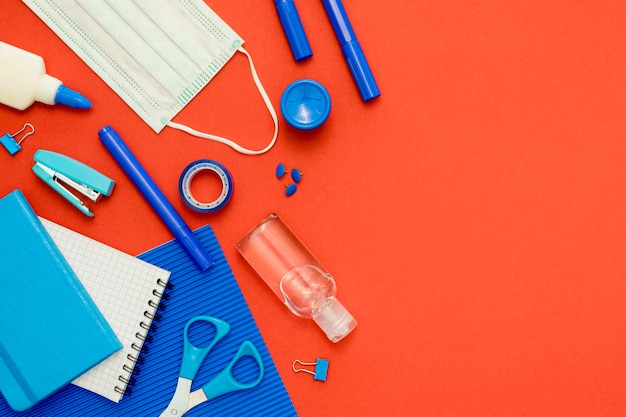 Flat lay school items on red background