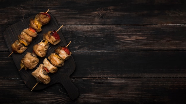 Flat lay skewers on cutting board  with copy-space