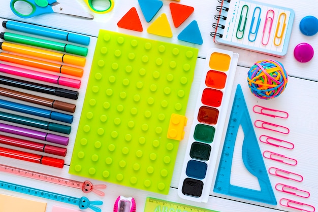 Flat-lay stationery chalk board on white of the table