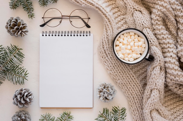 Flat lay stationery empty papers and reading glasses