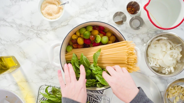 Flat lay. Step by step. Cooking on pot pasta recipe in an enameled cast iron dutch oven.