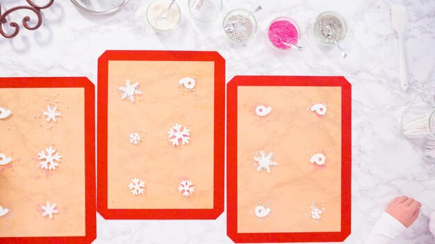 Flat lay. Step by step. Making homemade lollipops with fondant snowflakes.