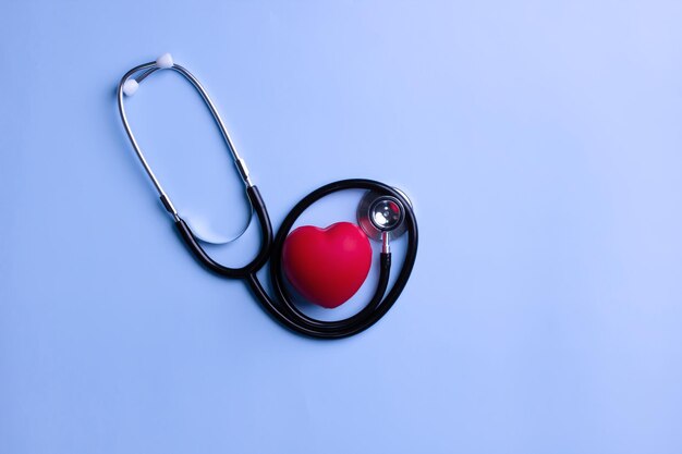 Flat lay of stethoscope is with red heartbeat for checkup Heart attack prevention Health care concept