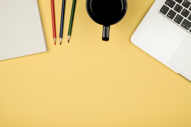 Flat lay style picture of workspace with office supplies on pastel colored background Top view