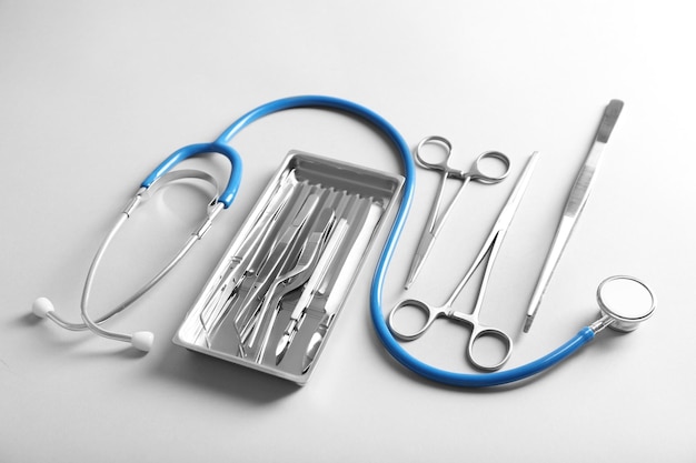 Photo flat lay of surgery instruments on white background