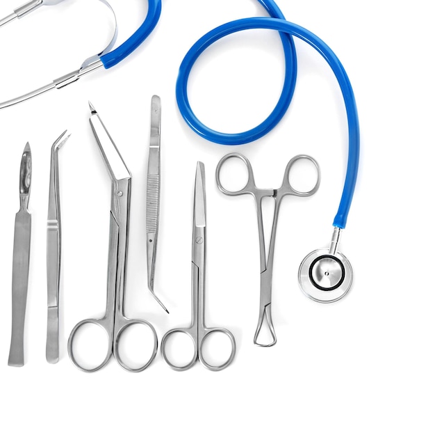 Flat lay of surgery instruments on white background