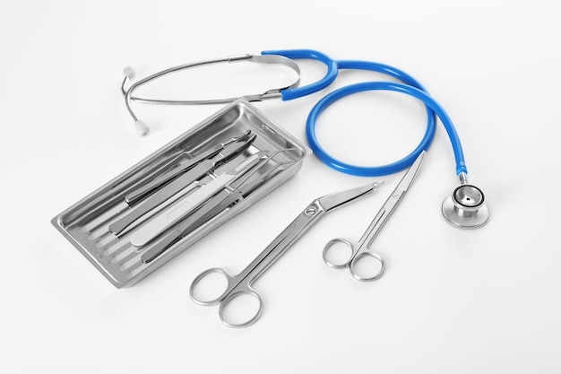 Photo flat lay of surgery instruments on white background