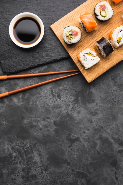 Flat lay sushi arrangement with copy space