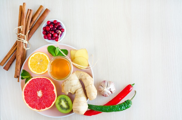 Flat lay, top view natural products, health food with vitamin C on wooden background.