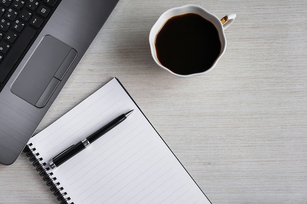 Flat lay, top view office desk writing desk. Workspace with blank clip board, keyboard, stationery, pen and cup of coffee on a desk. Office concept