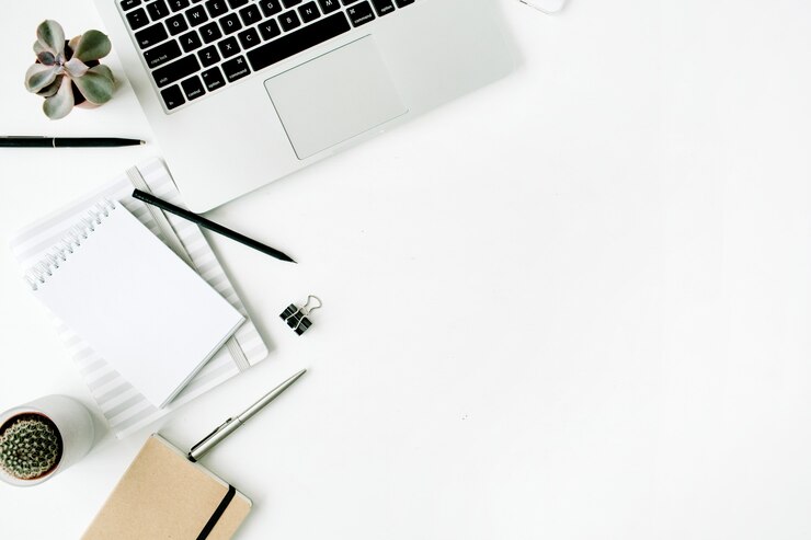 Photo flat lay, top view stylish office table desk. workspace with laptop, diary, succulent on white.