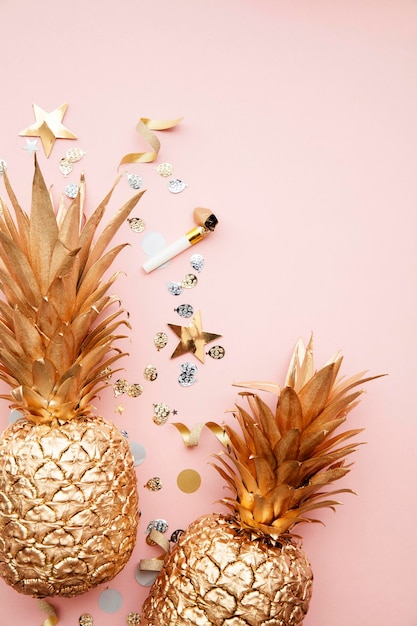 Flat lay tropical pineapple and confetti party celebration background