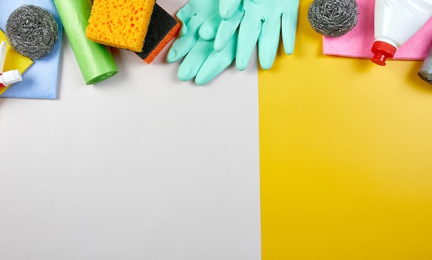 Flat lay of variety house cleaning product on color table