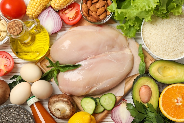 Flat lay of various vegetables and fruits with meat