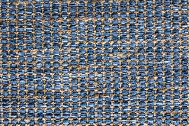 Flat lay view of blue color braided jute rug background texture concept