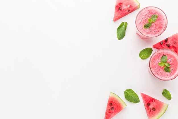 Photo flat lay of watermelon cocktail glasses with copy space