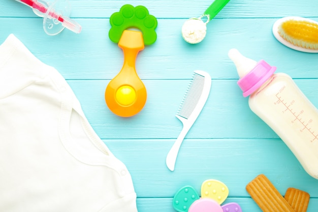 Flat lay with baby toys and milk bottle