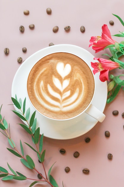 Flat Lay with Cappuccino, Flowers and Coffee Beans