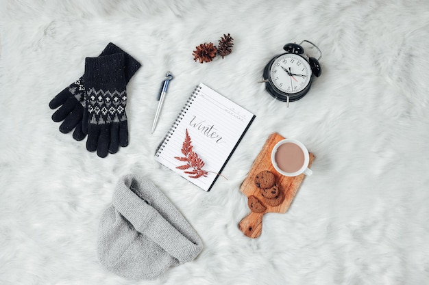 Photo flat lay with creative composition of winter  accessories background