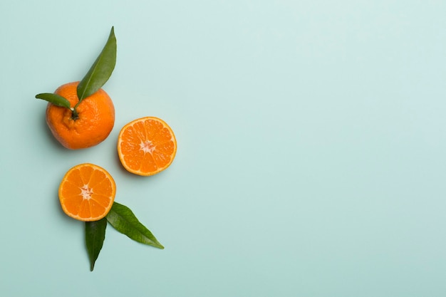 Flat lay with fresh mandarines on color background Top view