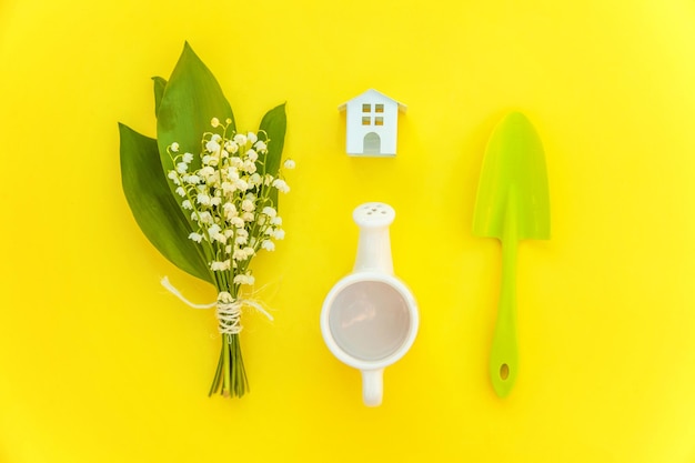 Flat Lay with gardening tools on yellow background