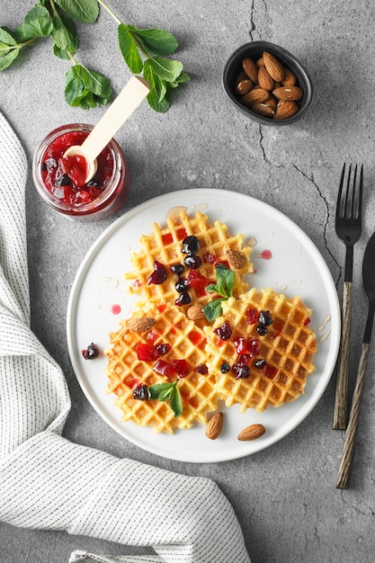 Flat lay with grapefruit marmalade with berry platter.