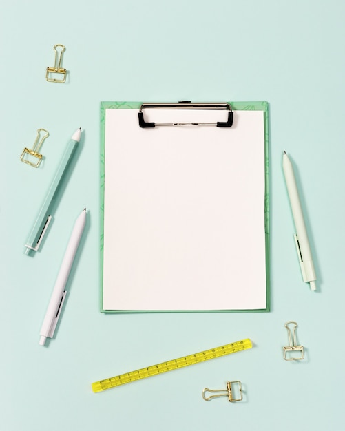 Flat lay with office supplies and clipboard