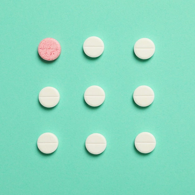 Flat lay with pills of various colors isolated