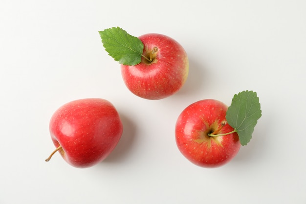 Flat lay with red apples on white table