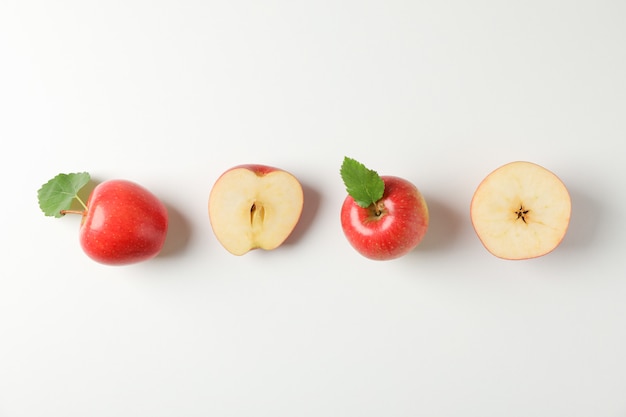 Flat lay with red apples on white table