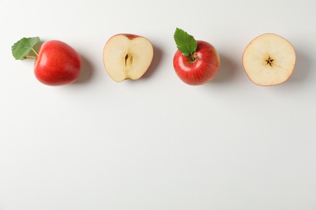 Flat lay with red apples on white table