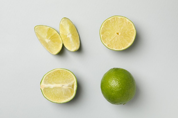 Flat lay with ripe lime on gray background