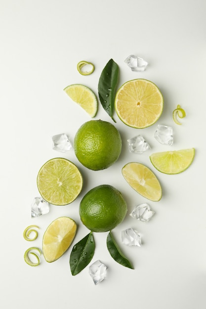 Flat lay with ripe lime on white background