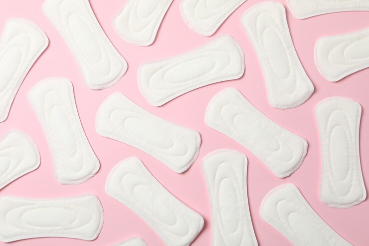 Photo flat lay with sanitary pads on pink surface