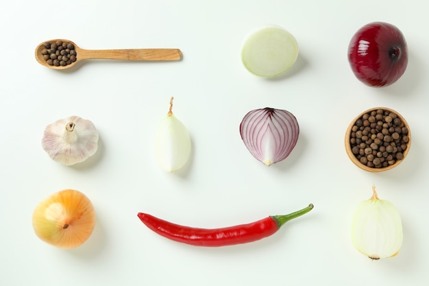 Photo flat lay with spicy vegetables on white background