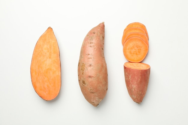 Flat lay with Sweet potatoes on white surface