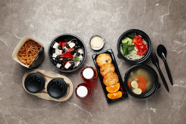 Flat lay with takeaway food on table. Food delivery