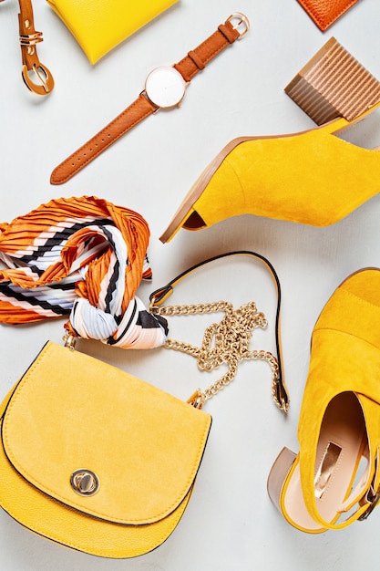 Photo flat lay with woman fashion accessories in yellow colors. fashion, online beauty blog, summer style, shopping and trends concept