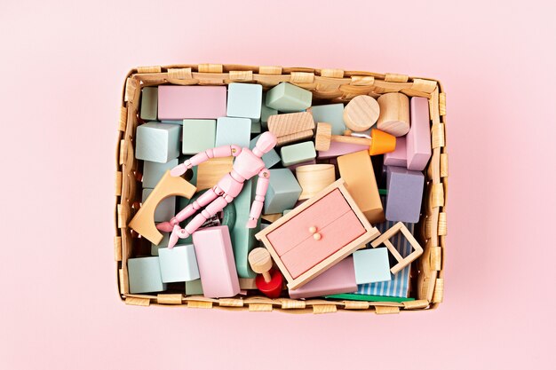 Flat lay with wooden  blocks in pastel colors. Eco friendly, zero waste, plastic free, educational, gender neutral toys for children. Copy space, top view