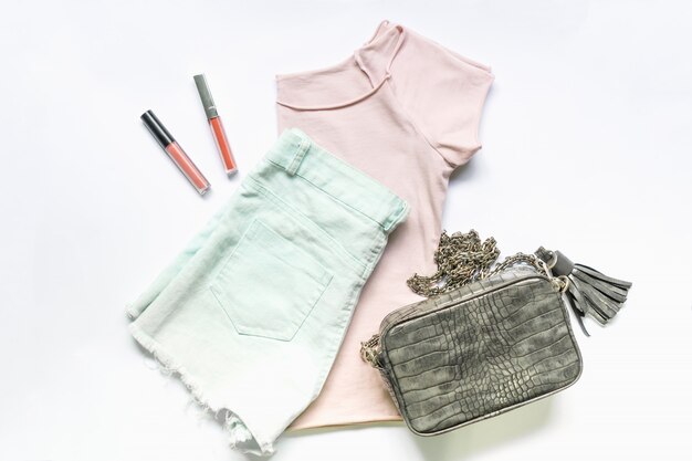 Flat lay of woman clothes and accessories set with  handbag. 