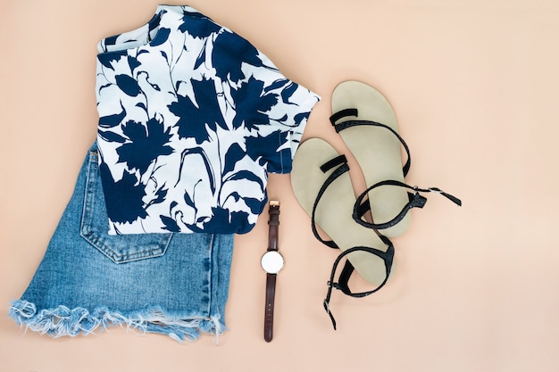 Flat lay of woman clothes and accessories set with shoes, watch. 