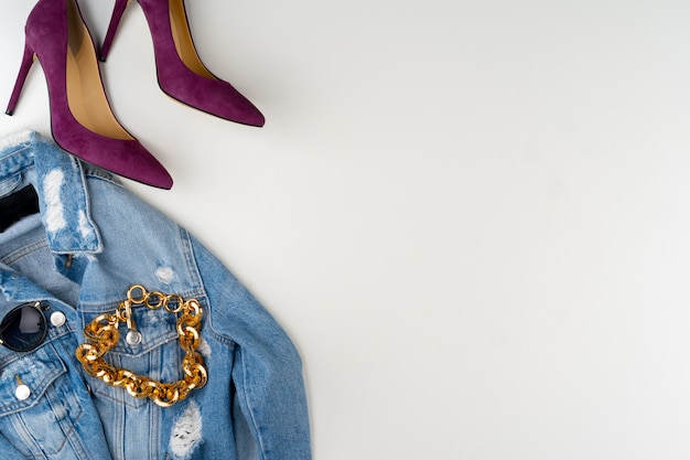 Flat lay of woman summer outfit on white background