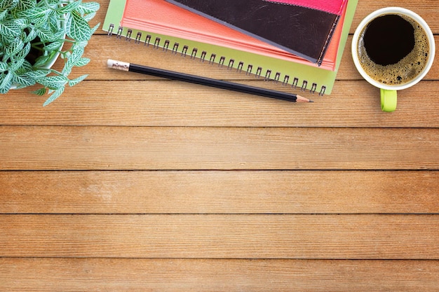 Flat lay wood office desk with office equipment