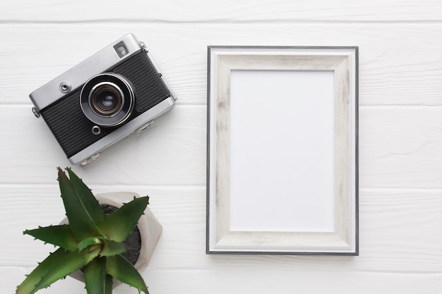 Photo flat lay of wooden frame with copy space