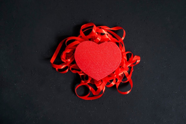 Flat layout of a red valentine box and ribbons