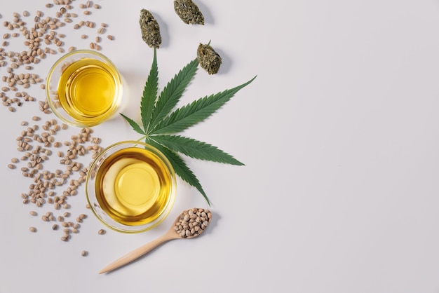 Flat ray top view image of marijuana set feature with CBD oil and dehydrated bud