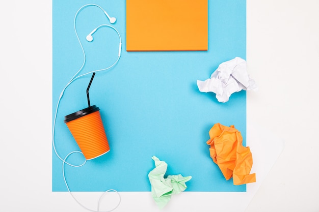 Flat view of the office desk with a creative arrangement of stationery and notebooks for the desktop