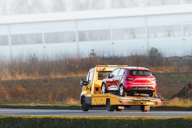 Photo flatbed tow truck in action roadside recovery 24 at 7 car service