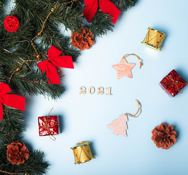 Flatlay Christmas . Wooden numbers 2021. Copy space. Stars. blue background.