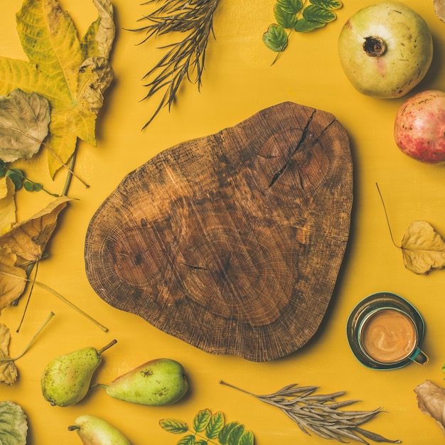 Flatlay of cup of espresso and wooden board square crop